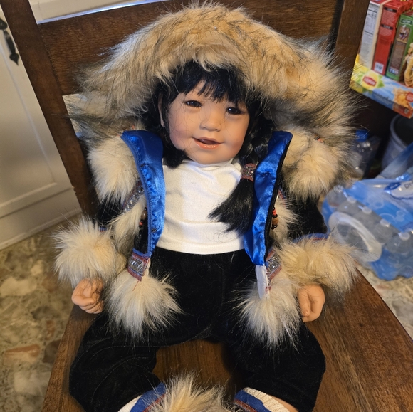 Adorable Fur-Trimmed Doll with Blue Accents